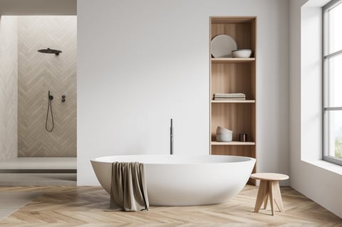 Light bathroom interior with shower and bathtub