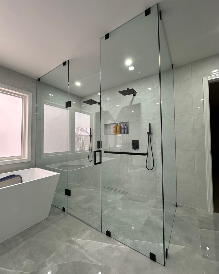 Modern bathroom with frameless glass shower enclosure and soaker tub