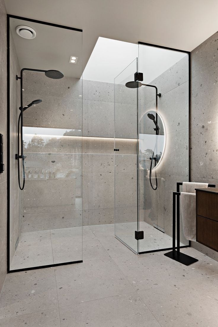 Modern minimalist bathroom with frameless glass shower