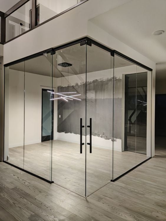 Modern glass shower enclosure with black frame