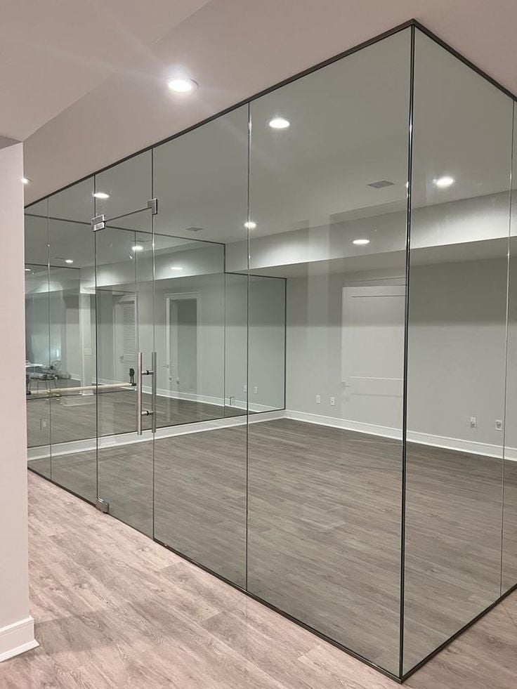 Modern glass-walled commercial space with polished concrete floors